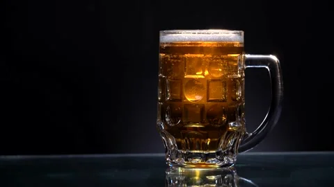 Panorama of light beer on the dark background Stock Footage 154304011