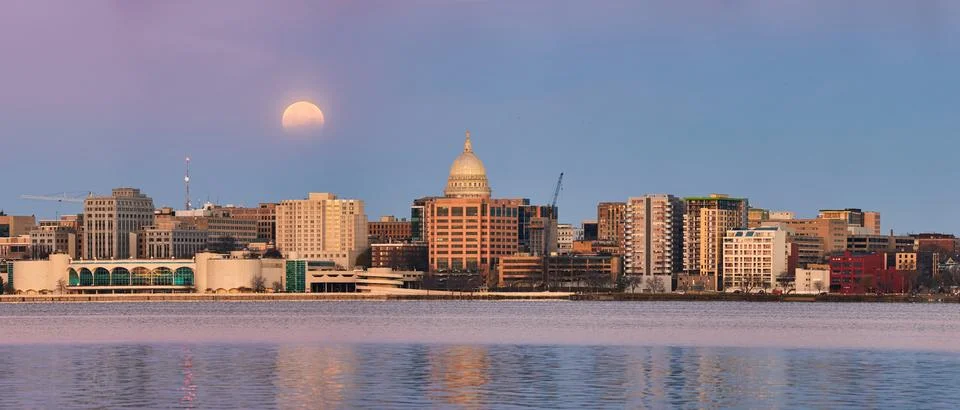Panorama of a lunar eclipse behind the skyline of Madison, WI. Stock Photos