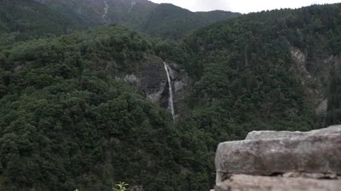 Panorama of mountain with forest and a high waterfall in Switzerland, Europe. Stock Footage 156777059