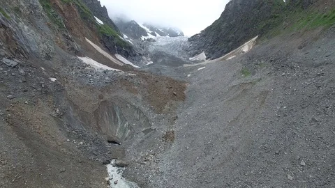 Panorama of the mountain gorge in front of the glacier Video stock 77181244