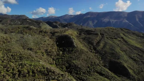 Panorama of mountain landscape top of dense green spruce forest on slopes aerial Stock Footage 152930851