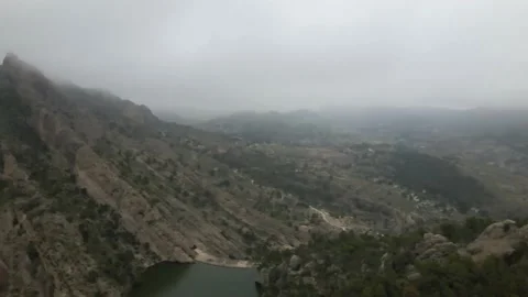 Panorama of mountain peaks in the clouds Stock Footage 239942144