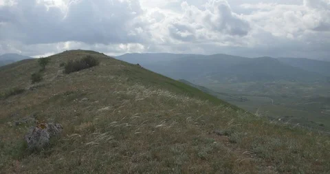 Panorama of the mountainous landscape under the cloudy sky Stock Footage 91402254