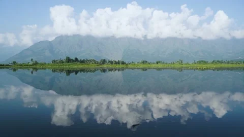 Panorama of mountains and clouds with a reflection on Dal Lake, Kashmir, India Video stock 285117730