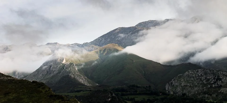 Panorama of Mountains Between the Clouds Stock Photos