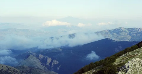 Panorama of mountains, covered with clouds, volcano Etna afar, Sicily, timelapse Stock Footage 111729829