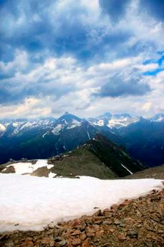 Panorama of mountains scene with dramatic blue sky in national park of Dombay Stock Photos