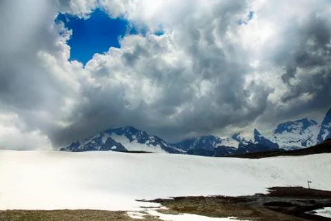 Panorama of mountains scene with dramatic blue sky in national park of Dombay Stock Photos