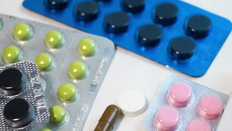 Panorama of multi-colored blisters with different tablets Video stock 171604424