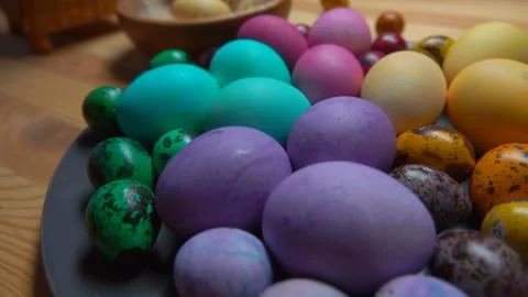 Panorama of multi-colored Easter eggs on the grey plate on the wooden table Stock Footage 147202250