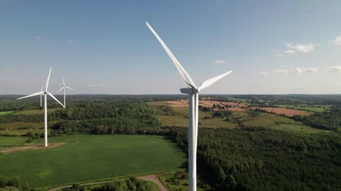Panorama of nondescript white wind farm in gorgeous rural countryside. Stock Footage 281836246