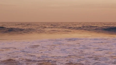 Panorama of ocean waves at sunset Stock Footage 86240892