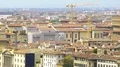 Panorama of old buildings, construction cranes and Vecchio bridge in Florence HD Footage