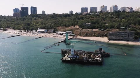 Panorama of old haven crane in the silent bay near modern resort in green hills Video stock 144680681