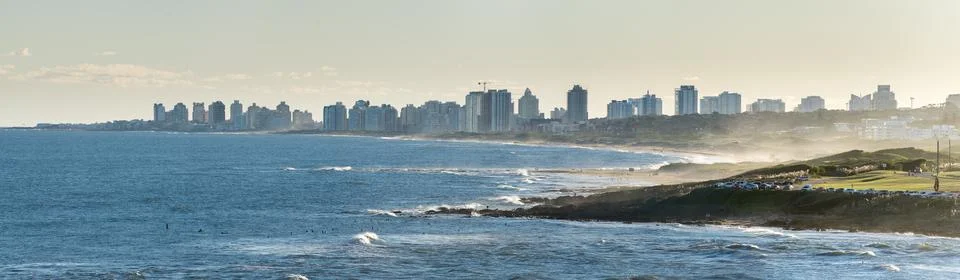 Panorama of the Punta del Este skyline seen from La Barra, with the mouth o.. Stock Photos