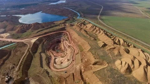 Panorama of the quarry. Artificial lake. Sunset. Horizon. Development of Stock Footage 75039696