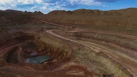 Panorama of the quarry. Artificial lake. Sunset. Barkhan sands. Development of Stock Footage 75040840