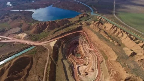 Panorama of the quarry. Artificial lake. Sunset. Horizon. Development of Stock-Footage 75249792