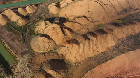Panorama of the quarry. Artificial lake. Sunset. Barkhan sands. Development of Stock Footage 75263419