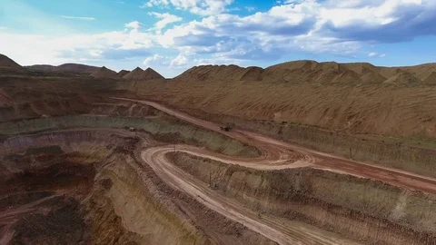 Panorama of the quarry. Artificial lake. Sunset. Barkhan sands. Development of Stockbeeldmateriaal 75287921