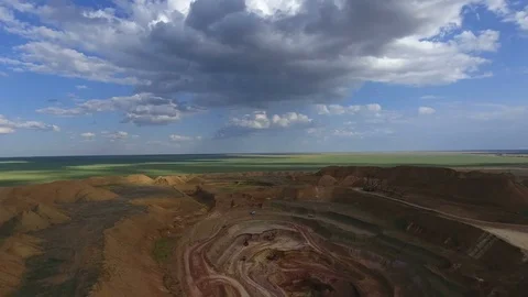 Panorama of the quarry. Artificial lake. Sunset. Barkhan sands. Development of Stockbeeldmateriaal 75375231