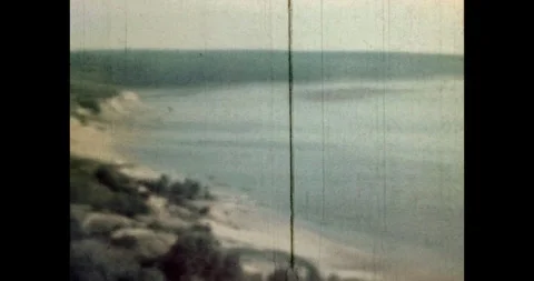 Panorama of the river, estuary, cliff with trees, sand dunes. Archive, film 動画素材 253266335