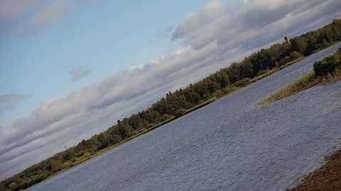 Panorama of the river at sunset. Sunset, wide river. Video stock 96043343