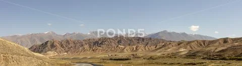 Panorama of road through Chu River Valley gorge in rural Kyrgyzstan Stock Photos