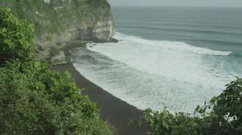 Panorama of rock and big wave in slow motion at Uluwatu, Bali. Red Epic, 4K Stock Footage 49678577