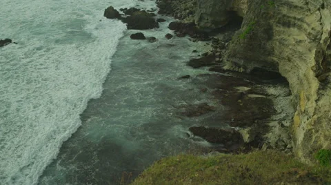 Panorama of rock and big wave in slow motion at Uluwatu, Bali. Red Epic, 4K Stock Footage 49678630