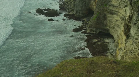 Panorama of rock and big wave in slow motion at Uluwatu, Bali. Red Epic, 4K Stock Footage 49679376