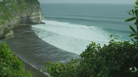 Panorama of rock and big wave in slow motion at Uluwatu, Bali. Red Epic, 4K Stock Footage 49679457