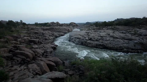 Panorama- rough rapids in rocky river in Hampi, India and white birds flying Stock Footage 33849707