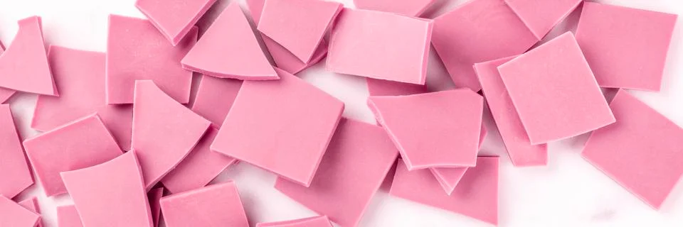 A panorama of ruby chocolate, shot from the top on a white marble background Foto stock