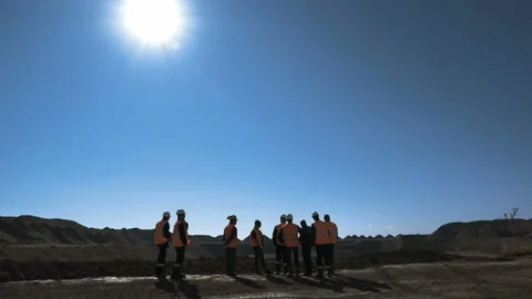Panorama shot of a group of workers in overalls actively speaking on board a Stock Footage 87730450