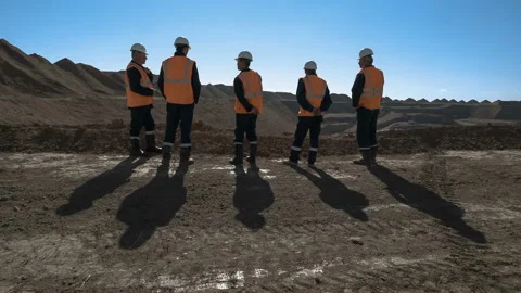 Panorama shot of a group of workers in overalls actively speaking on board a Stock Footage 87730886