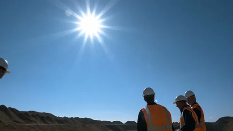 Panorama shot of a group of workers in overalls actively speaking on board a Stock Footage 87731160