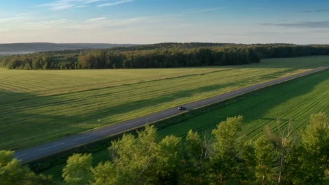 The panorama shot of the road and the fields. Stock Footage 112196950