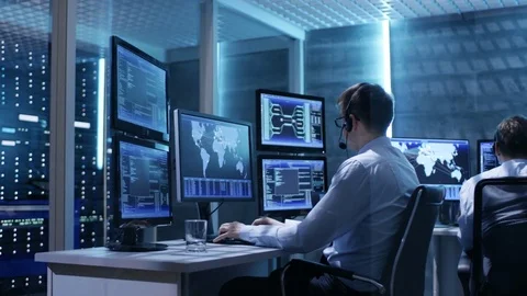 Panorama Shot of System Control Room with Three Technical Controllers Working  Stock Footage 74927377