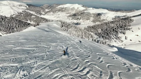 Panorama skiing of two ski professionals on mountain covered with fresh snow. Stock Footage 236924312