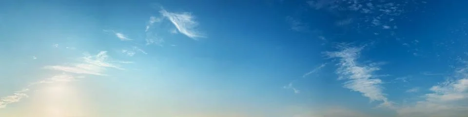 Panorama sky with beautiful cloud on a sunny day. Stock Photos