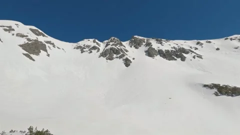 Panorama of Sunny winter mountains range in sunny day in snowy nature with blue Stock Footage 267570103