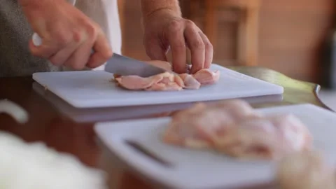Panorama of the table on which there is food. Hands take a piece of chicken Stock Footage 255769337
