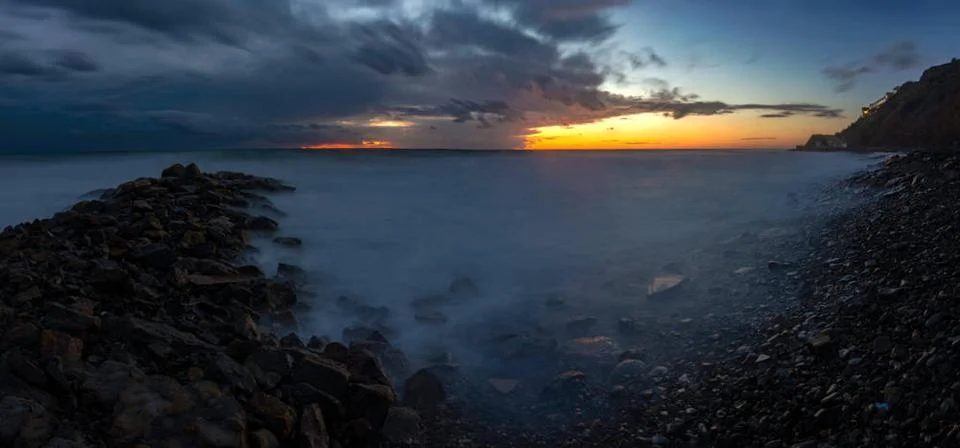 Panorama of three frames a general view of the rocky shore of the Black Se... Stock Photos