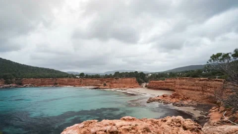 Panorama time lapse of bay Es Bol Nou in Ibiza, Spain, rainy day with clouds Video stock 174250909