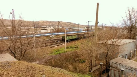 Panorama of a train carrying coal under the bridge Video stock 219770337