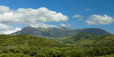 Panorama tranquil green mountain range landscape picturesque scenery Stock Photos