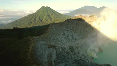Panorama of valley with active volcano, caldera crater with acid lake at sunrise Stock Footage 269895245