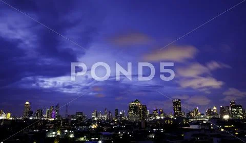 Panorama view of city skyline at night Stock Photos
