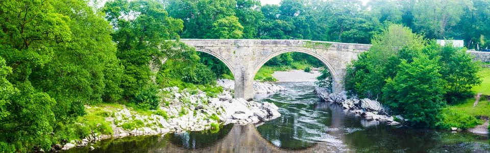 Panorama view of the Devils bridge and River Lune in Kirkby Lonsdale in Cumbr Stock Photos